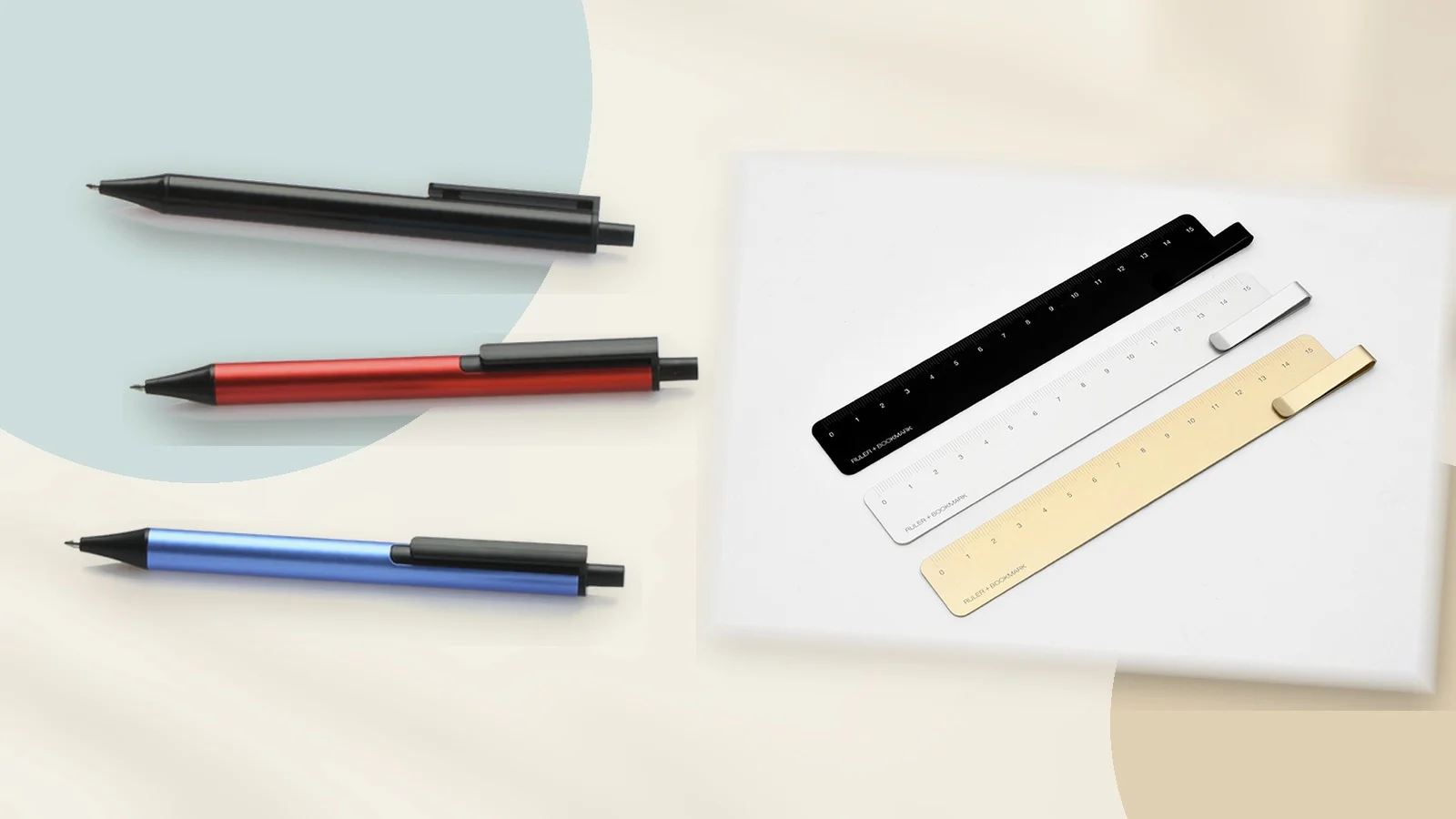 Black, red and blue KACO TUBE aluminium gel pens beside black, silver and gold KACO RUMA ruler bookmarks