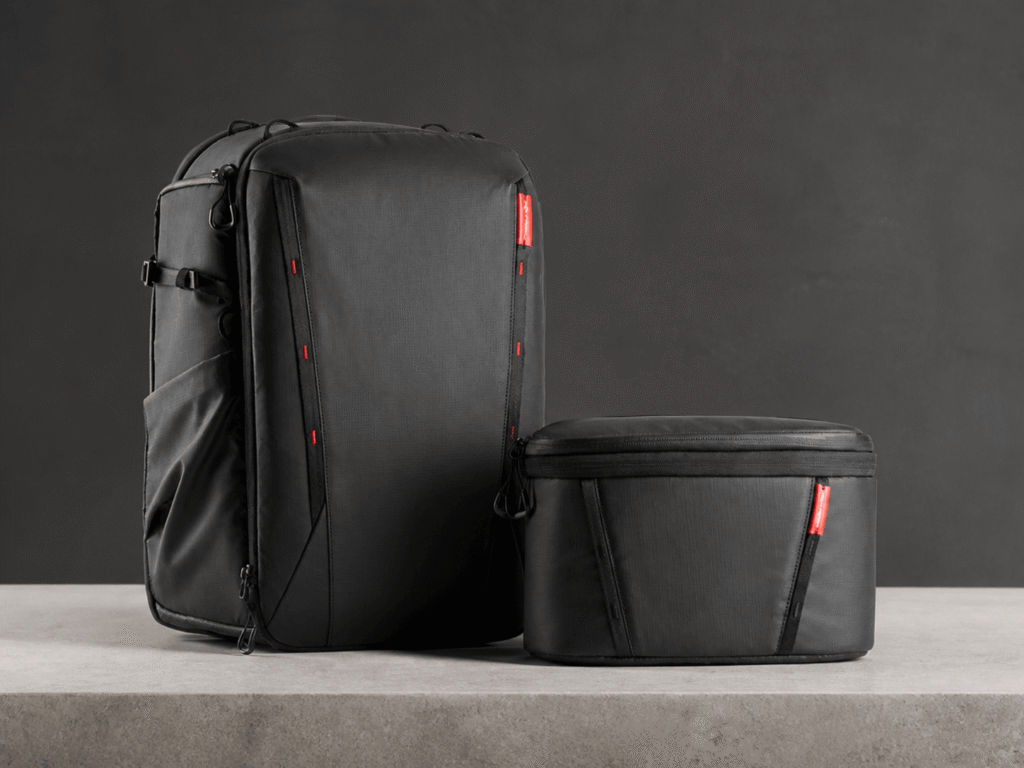 PGYTECH OneMo 2 black camera backpack with its removable shoulder bag on a neutral studio surface