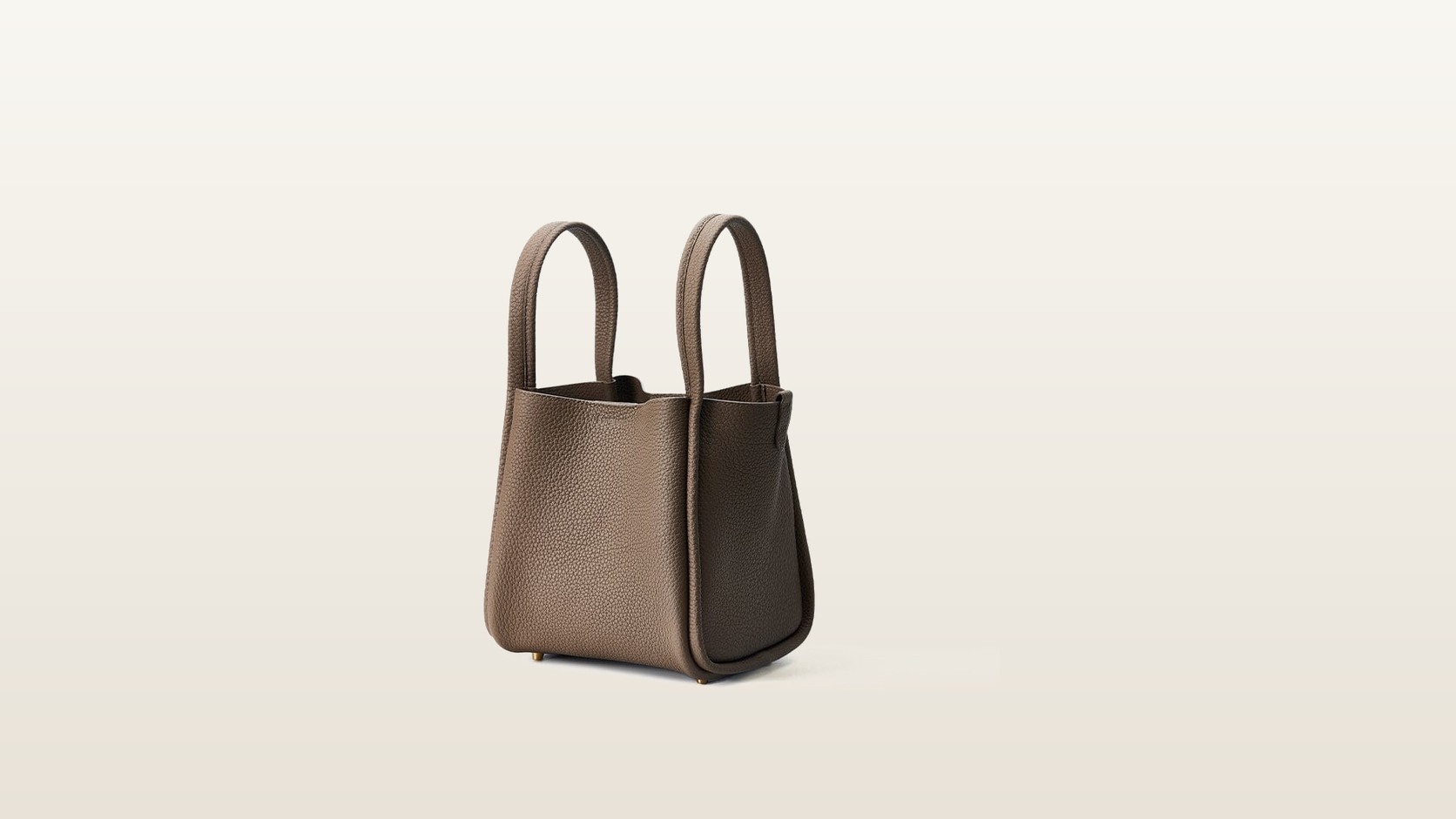 Taupe Songmont Medium Song Bag centred on a warm neutral background