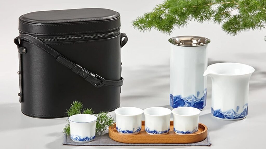 Complete ZENS Starboard travel tea service with case, teapot, fair cup and cups arranged together