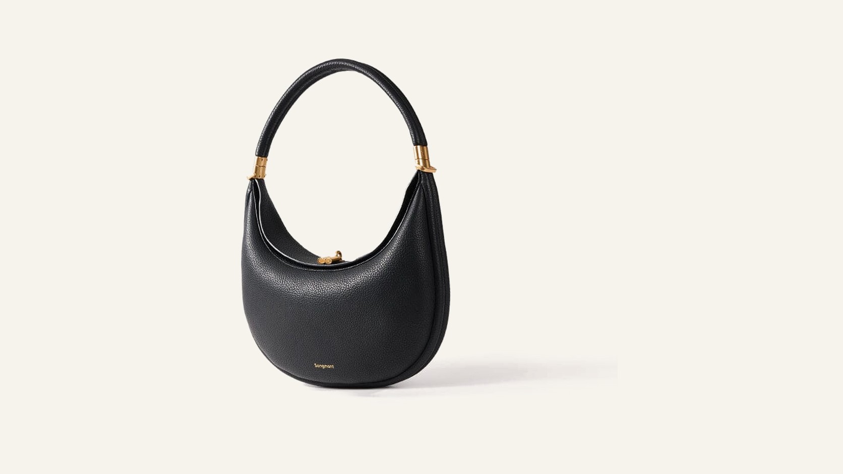 Complete black Songmont Luna Bag centred on a warm neutral background