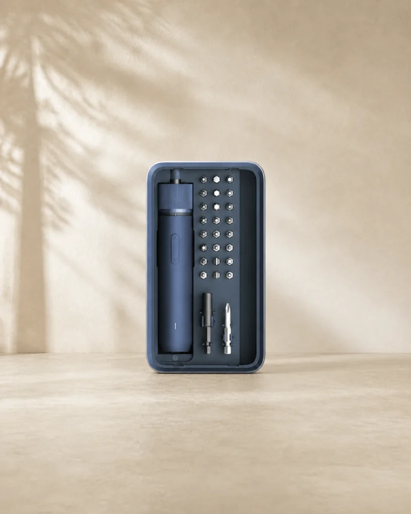 Complete HOTO Electric Screwdriver Kit Pro case with driver, bits and accessories shown in a portrait editorial setting