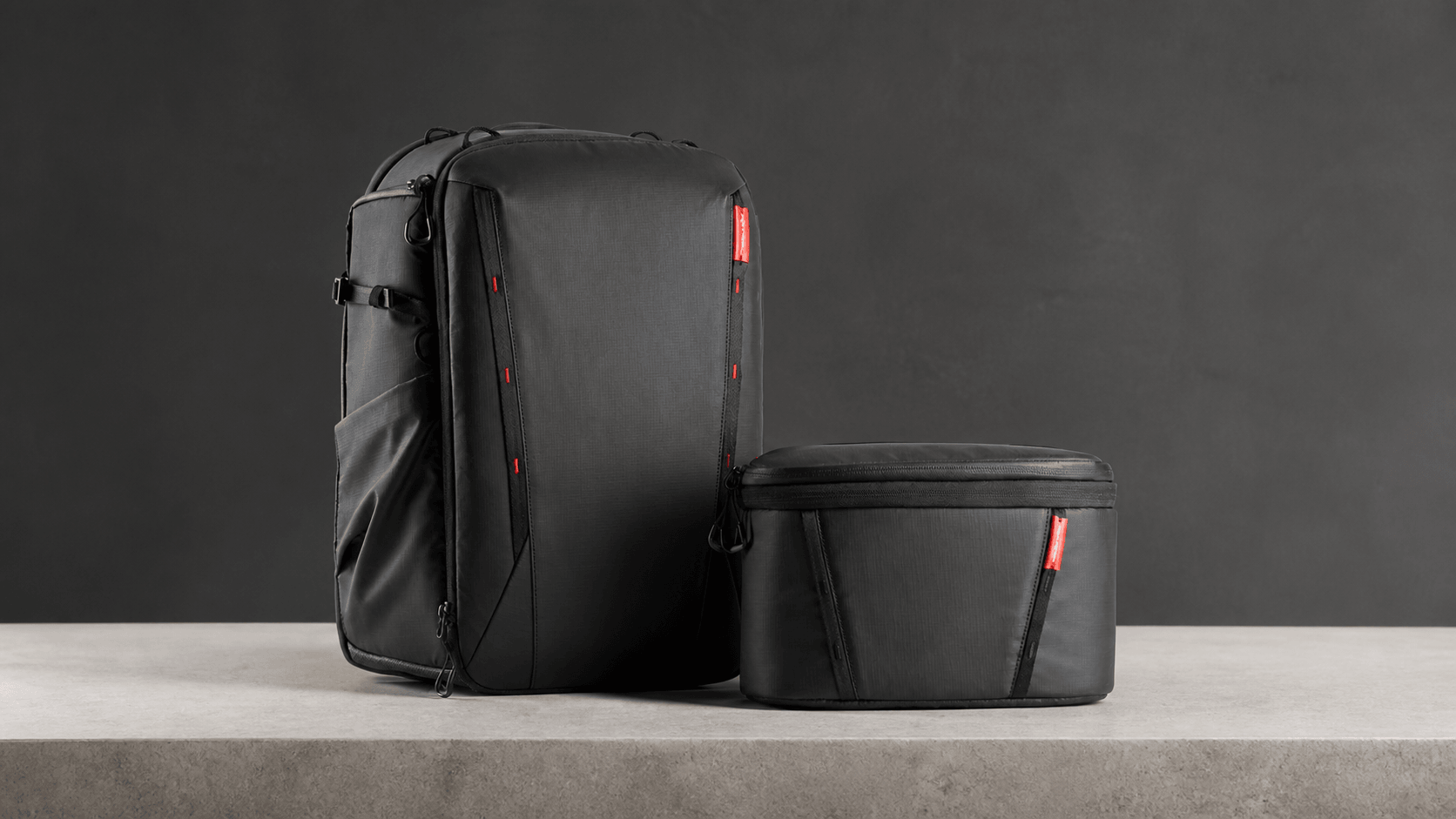 Wide editorial view of the PGYTECH OneMo 2 backpack and removable shoulder bag