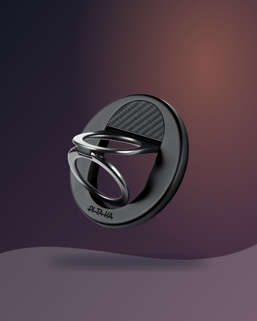 Black PITAKA MagEZ Grip 3 with its folding ring open on a dark warm editorial background