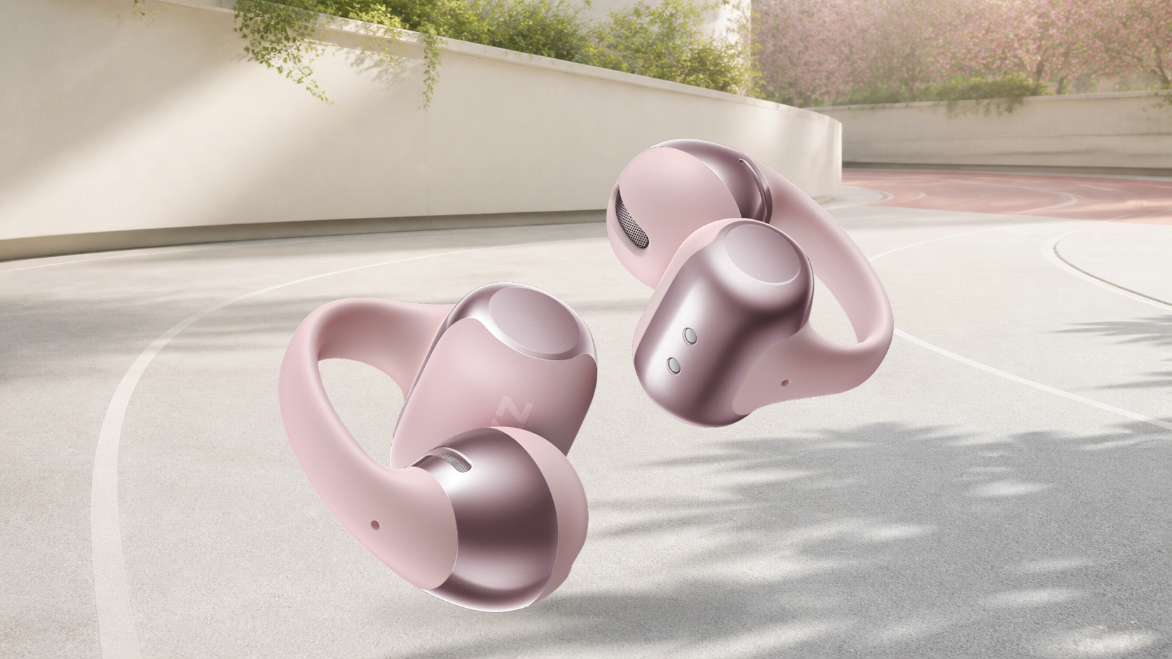 Wide complete official Shokz OpenDots ONE product view on a warm mineral editorial background