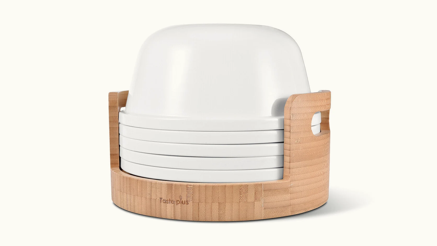 Wide view of the white Taste Plus dining set stacked inside a pale bamboo storage carrier