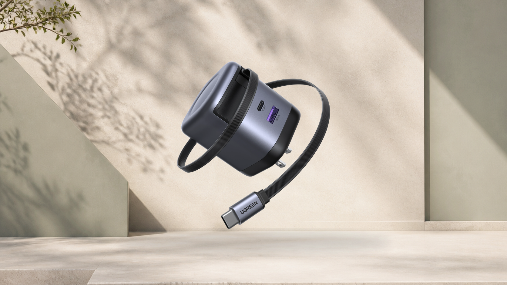 Wide view of the UGREEN Nexode 65W charger and retractable USB-C cable