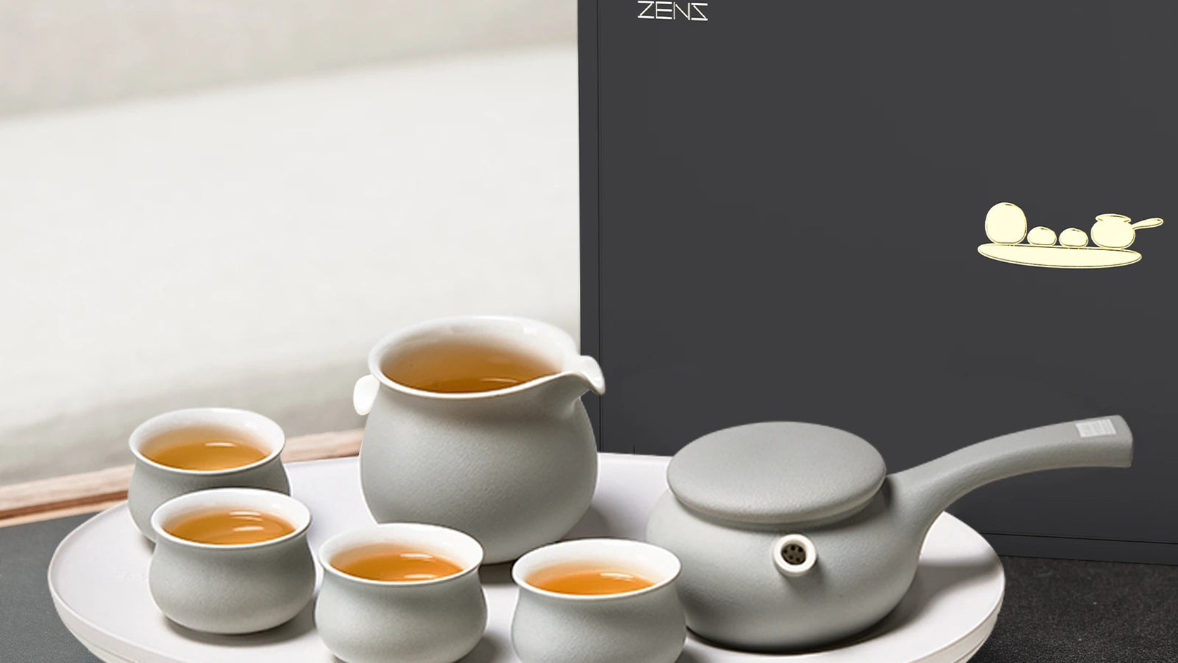 Wide official view of the ZENS gray ceramic Kyusu teapot, fair cup, cups and tray