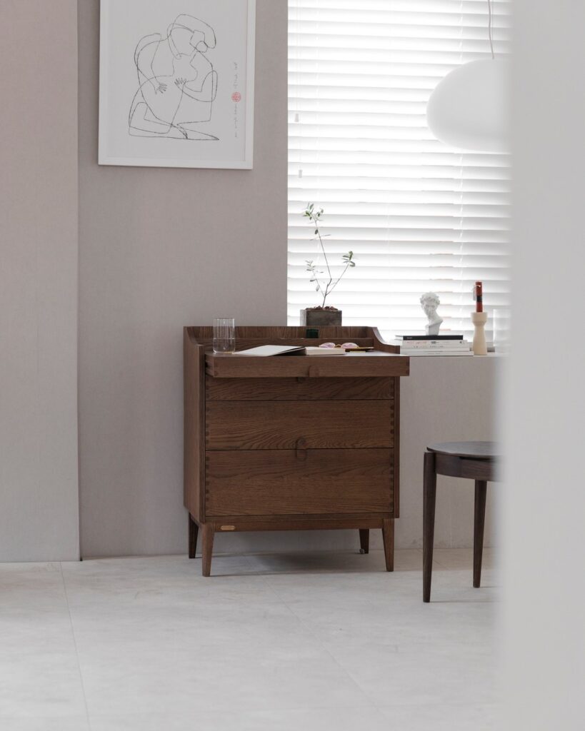 Complete ziinlife Fold bedside cabinet shown beside a small chair in a bright room