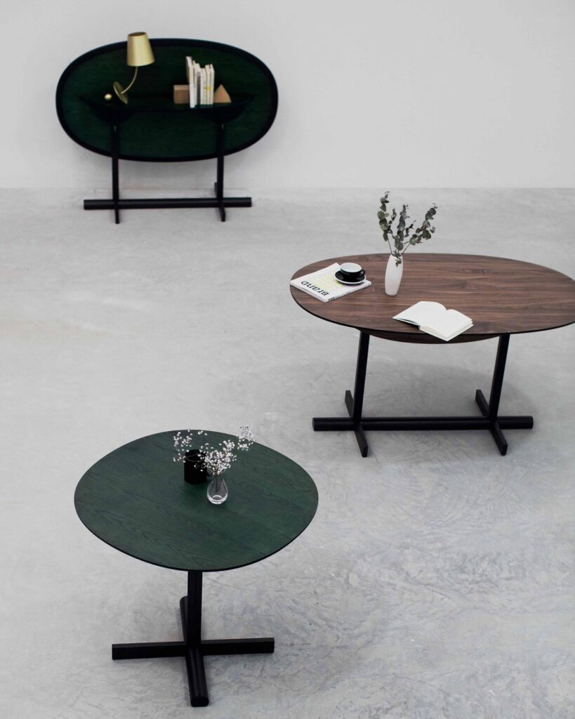 Three complete ziinlife Tree table configurations shown in an official furniture setting