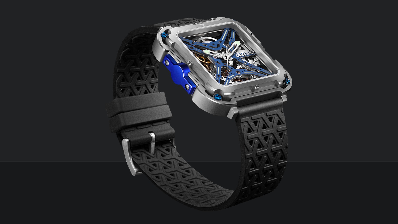 Complete CIGA design Gorilla skeleton watch with square case and black strap on a dark field