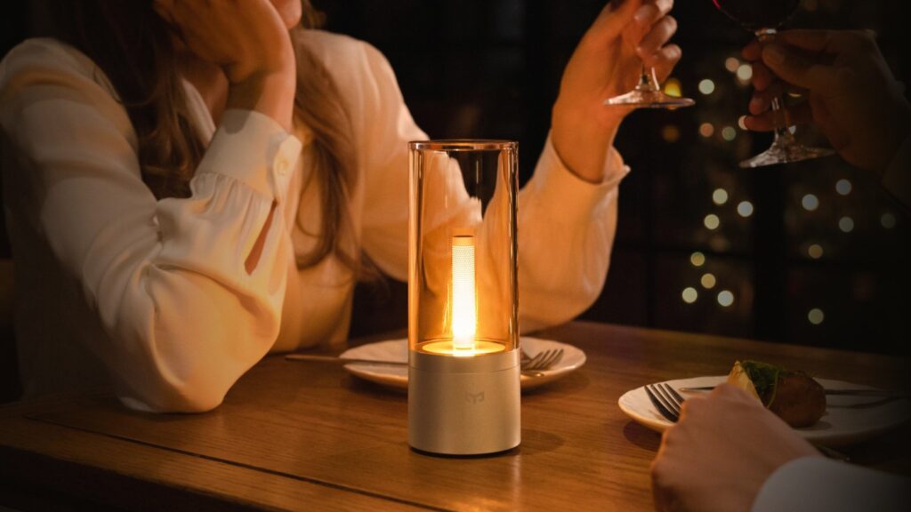 Yeelight Candela Lamp glowing at the centre of a warm dinner-table scene